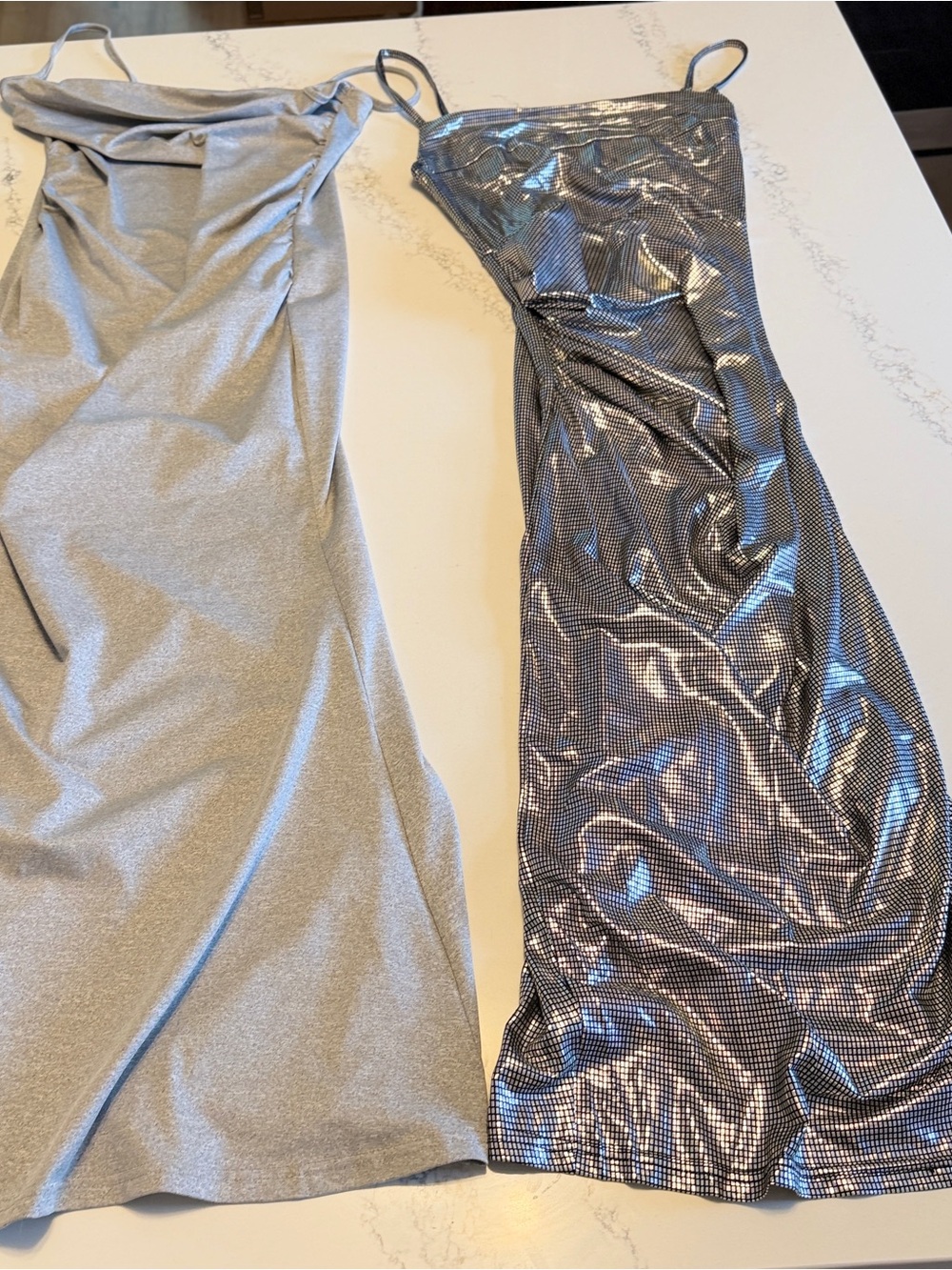 Set of 2 dresses machine wash no wrinkle stretchy. 1 flat gray, 1 shimmer NWOT
